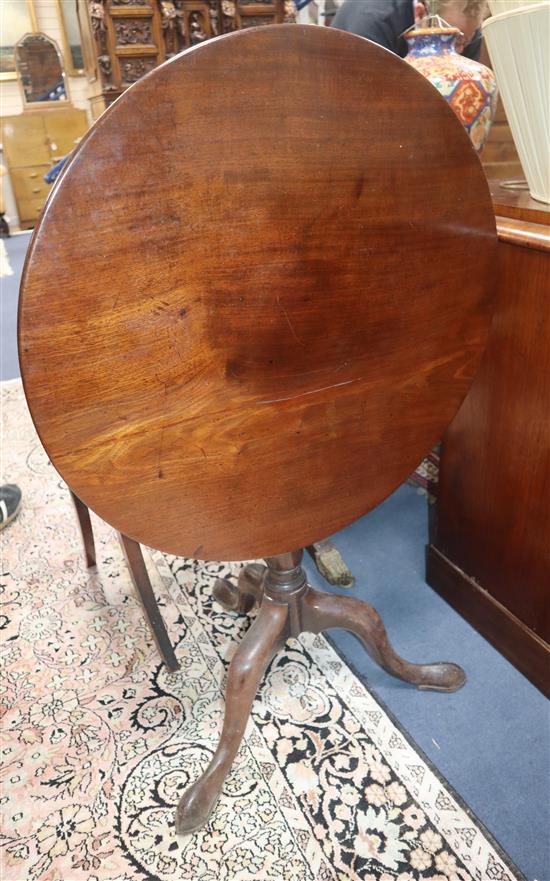 A George III mahogany circular tilt top tea table on tripod base Diameter 66cm